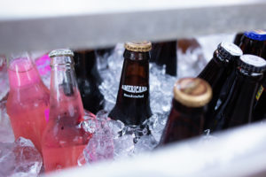 several beer bottles in a cooler